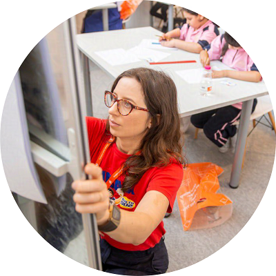 Emily Fellah drawing on a flip chart during a workshop