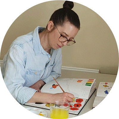 Emily Fellah painting in her sketchbook